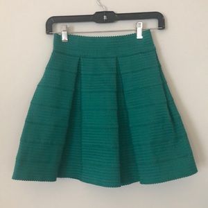 Green pleated skirt